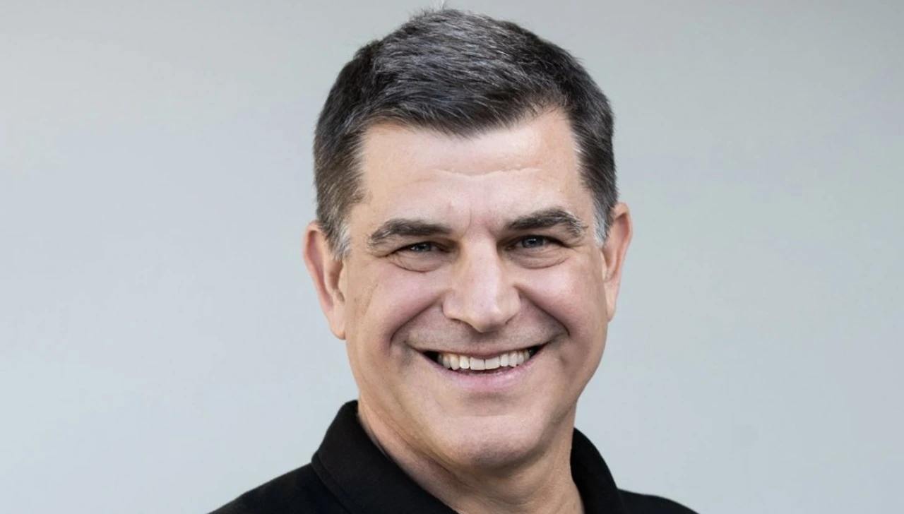 Portrait of Nicolas Szekasy smiling against a plain background