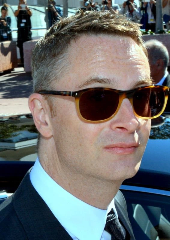 Nicolas Winding Refn at Cannes in 2016 wearing sunglasses and a suit