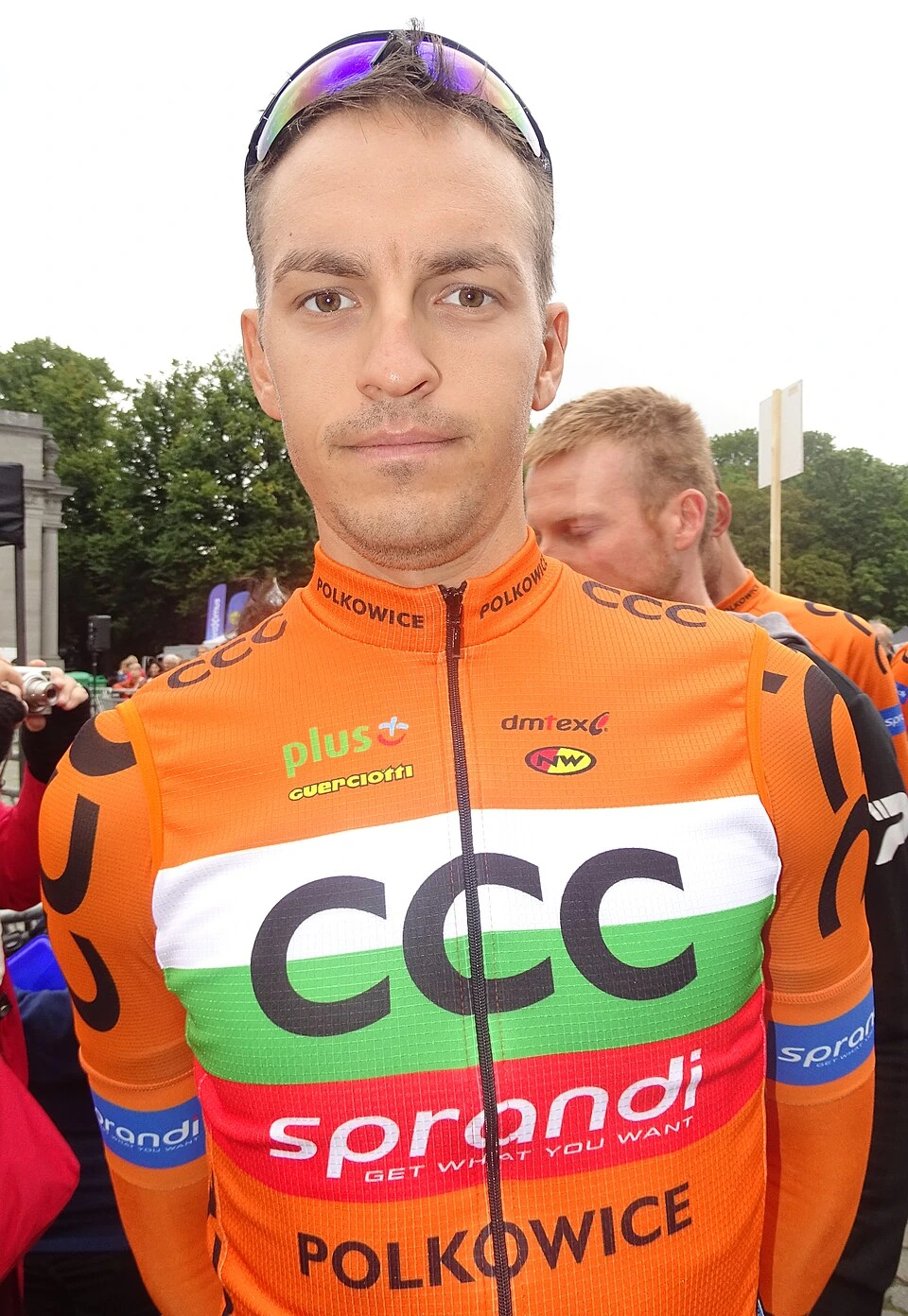 Nikolay Mihaylov in a cycling race, wearing an orange CCC team jersey
